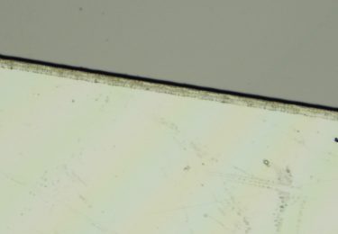 Laser micromachining of thin glass